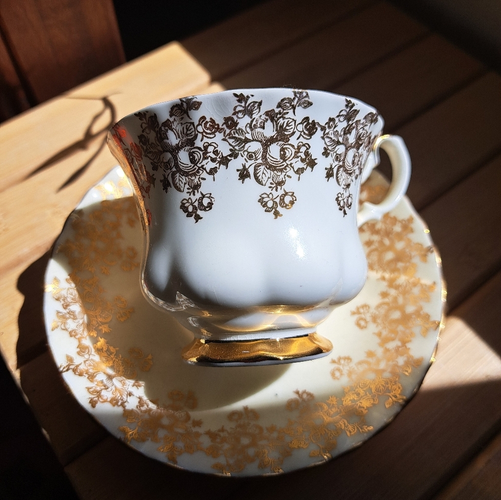 Elegant Gold Floral Teacup and Saucer